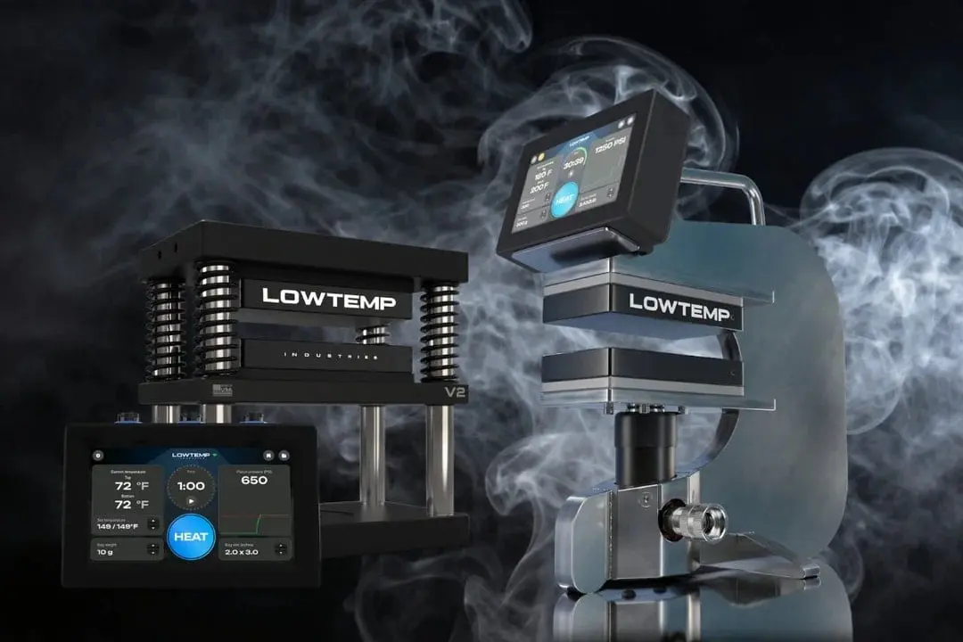 Two Lowtemp heat presses with touchscreen controls, surrounded by smoke against a dark background