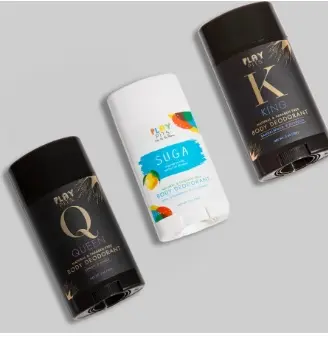 Play Pits Queen, Suga and King deodorant sticks laid out on a gray background