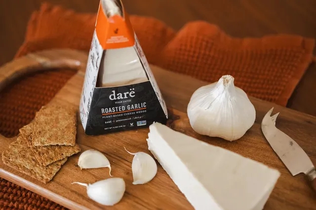 A wedge of Darë roasted garlic vegan cheese